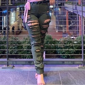Olive green jeans with holes on both sides
